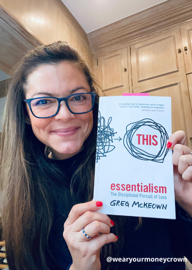 Me holding a copy of Greg McKeown's Essentialism book