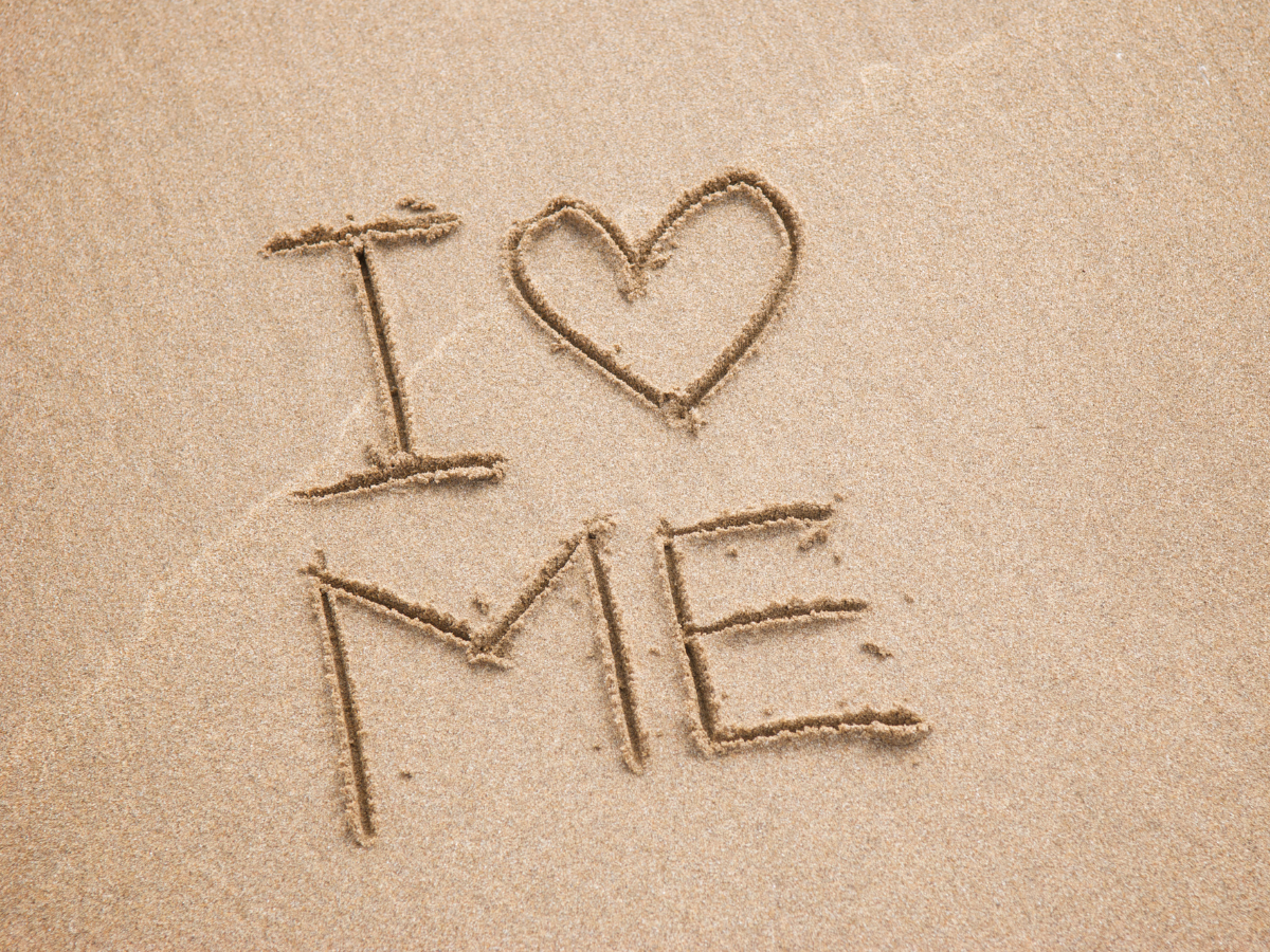 An image of sand with the words I LOVE ME