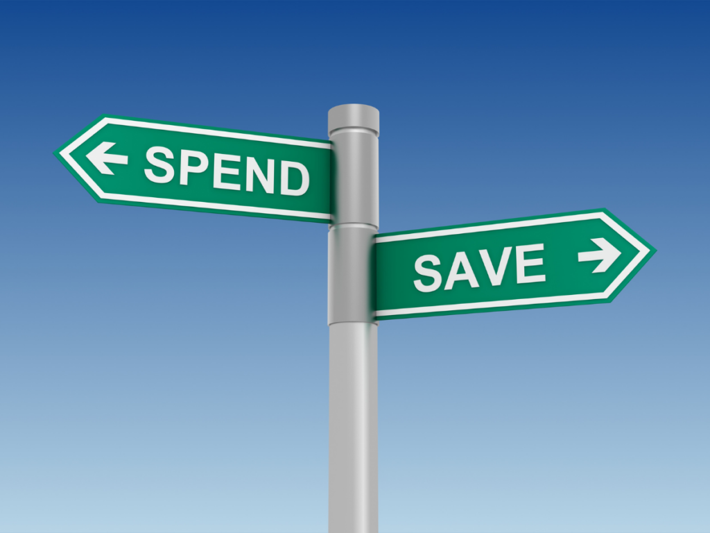 A sign with an arrow pointing to SAVE and another arrow to SPEND