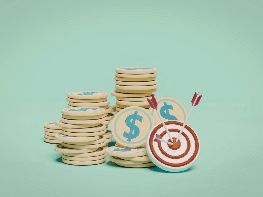 A pile of coins with an arrow hitting one of them as a goal
