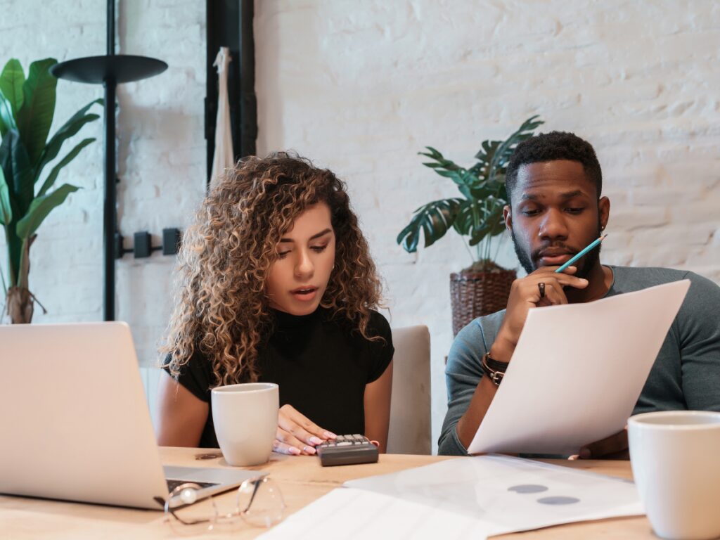 A couple reviewing their budgets together