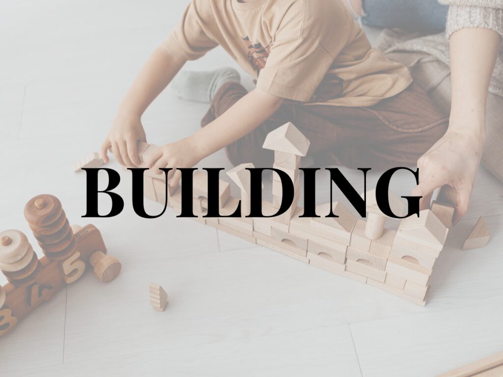 An image showing a child and parent with building blocks and the words BUILDING in bold.
